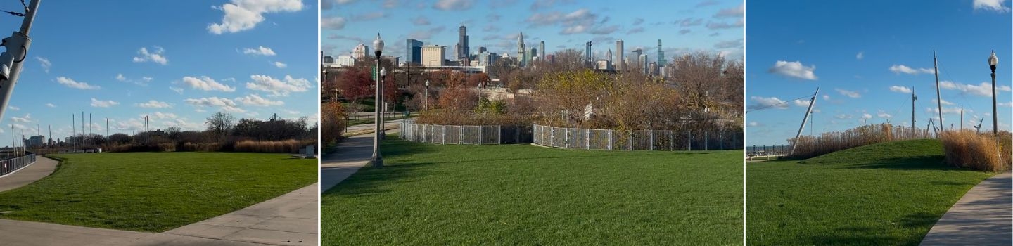 Panoramic view of a grassy park with a city skyline in the distance.
